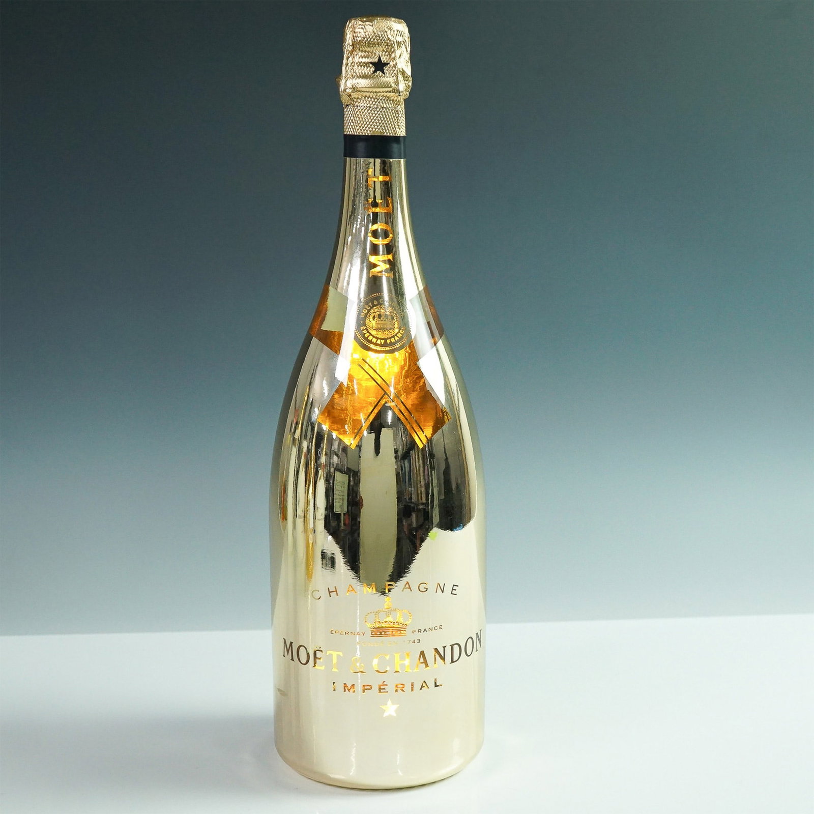 Moet & Chandon Imperial Gold Champagne Limited Edition Light-Up Magnum: A striking presentation of Moet & Chandon Imperial Brut Champagne, this limited edition 1.5-liter magnum features a reflective gold finish and an illuminated base that enhances its luxurious appeal. T
