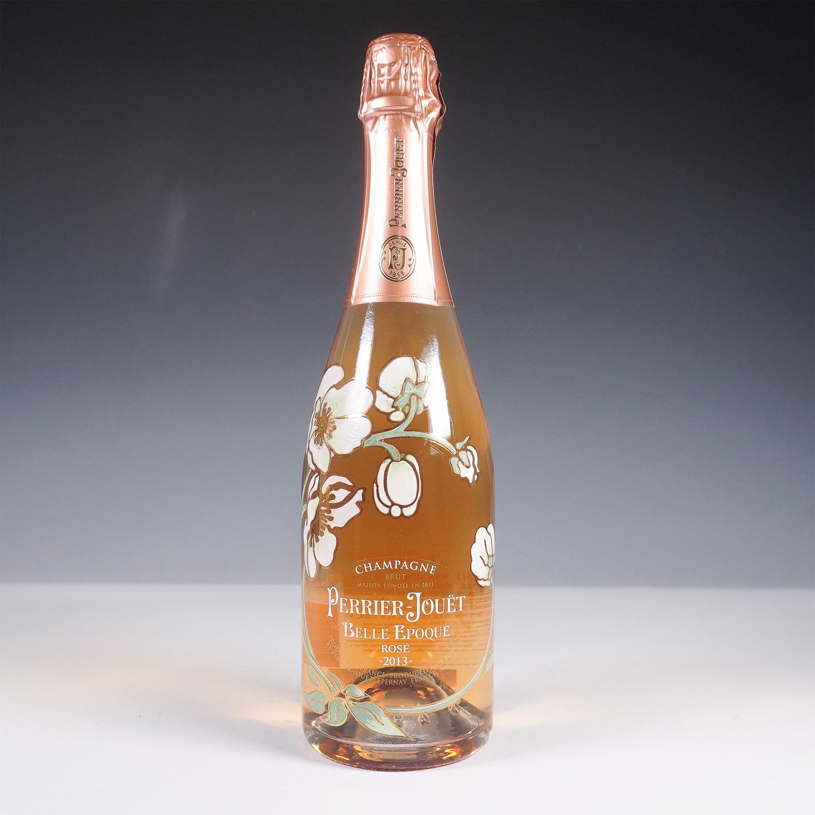 Perrier Jouet Belle Epoque Rose 2013 Champagne Limited Edition with Box: A bottle of Perrier Jouet Belle Epoque Rose 2013 vintage champagne, presented a Limited Edition decorative box designed by Mischer'Traxler. This special edition highlights the maison's signature flora