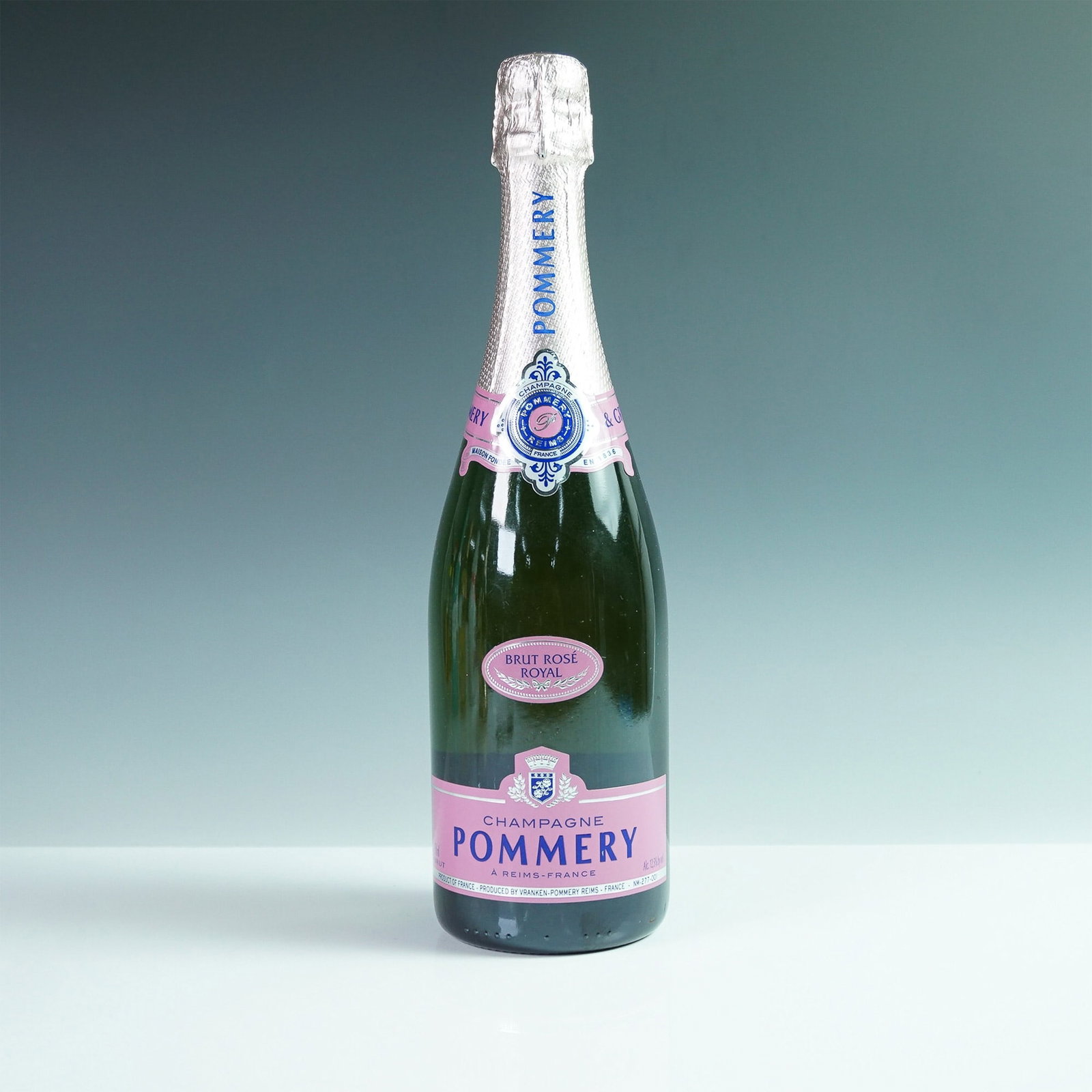 Pommery Champagne - Brut Rose Royal: This sealed Champagne is produced in Reims, France. The bottle contains 750mL of Champagne with an alcohol content of 12.5% by volume. The Champagne presents a delicate pale pink color with slightly s