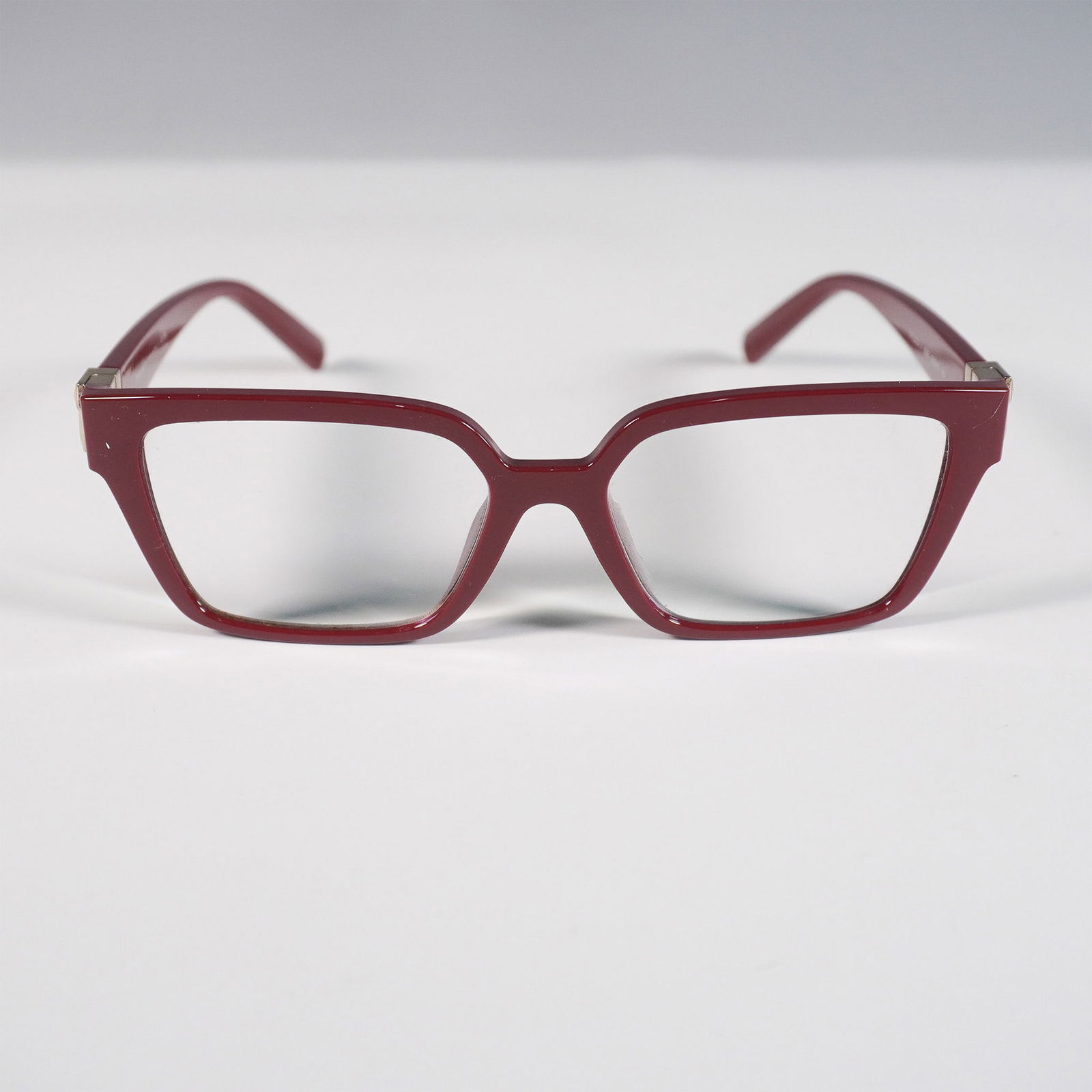 Tiffany & Co. Red Cat-Eye Optical Frames: Tiffany & Co. optical eyeglass frames in a rich red acetate with angular cat-eye silhouette. Features gold-tone hinge accents and signature Tiffany blue tips. Marked Tiffany & Co. Made in Italy on the
