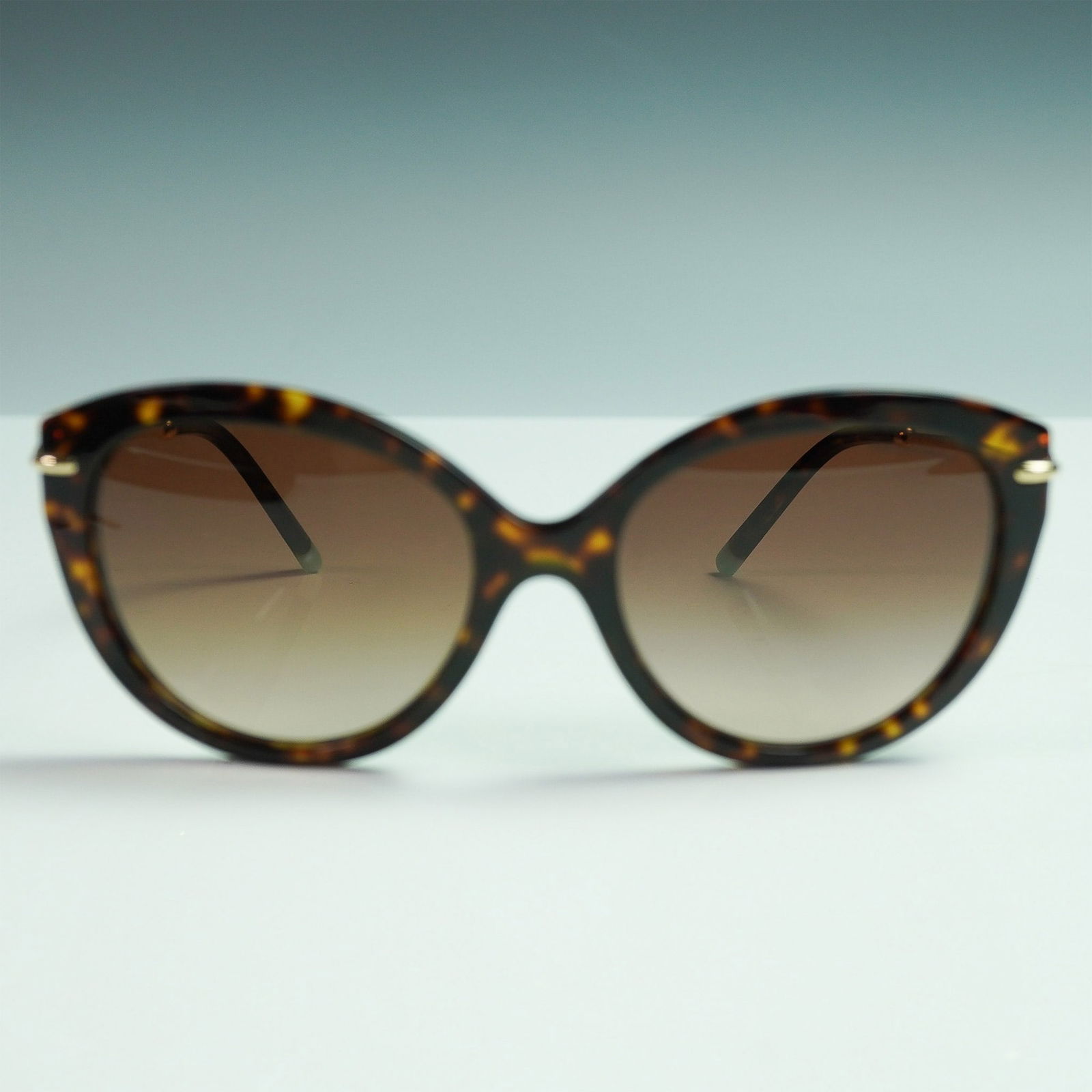 Tiffany & Co. TF4187 Havana Frame Sunglasses: Chic Tiffany & Co. designer sunglasses, model TF4187 in the 8015/3B colorway. These sunglasses showcase a Havana acetate frame paired with brown gradient lenses in a flattering cat-eye silhouette. The