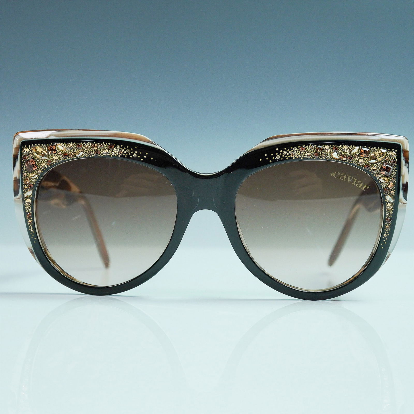 Caviar Champagne Series Cat-Eye Sunglasses: Elegant Caviar Champagne Series cat-eye sunglasses with a tortoiseshell frame and crystal embellishments. Made in Italy, featuring gradient lenses and marked MOD. 6895 C.24. Issued: 20th century Dimen