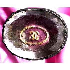 A scarce division one oval crystal button