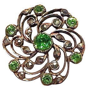 A division one striking pierced jeweled button