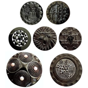 A small card of division one black glass buttons