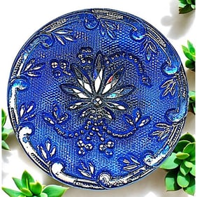 A division one silver lustered lacy glass button