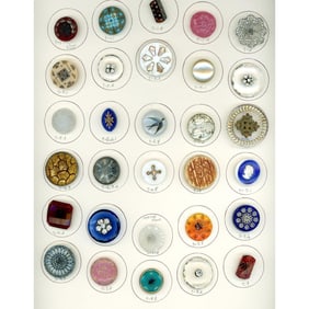 A full card of division one assorted glass buttons