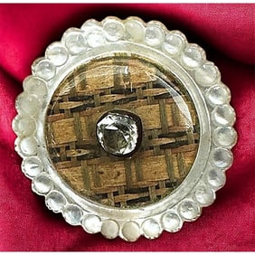 A division one glass in pearl button