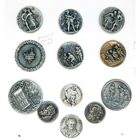 A partial card of division 1 & 3 white metal buttons.