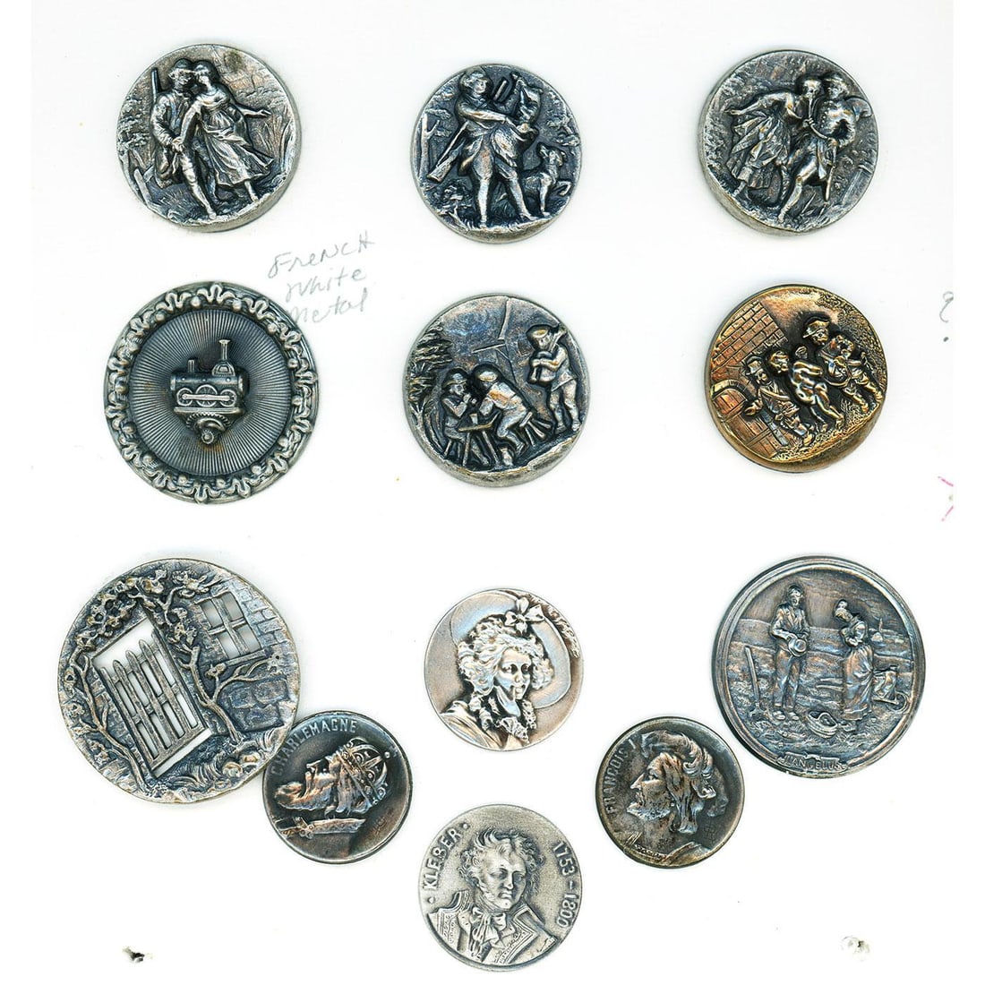 A partial card of division 1 & 3 white metal buttons. (1 of 4)