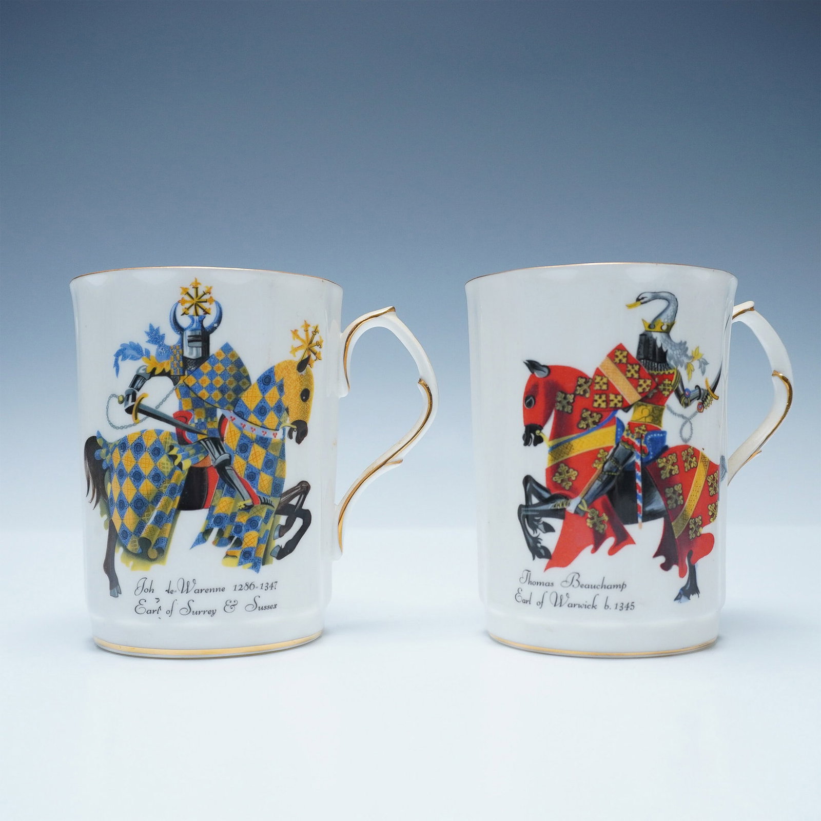 2pc Royal Windsor Medieval Knights Mugs: A pair of Royal Windsor fine bone china mugs, each featuring detailed depictions of medieval knights in full armor on horseback. One mug portrays John de Warenne, Earl of Surrey and Sussex (1286-1347)