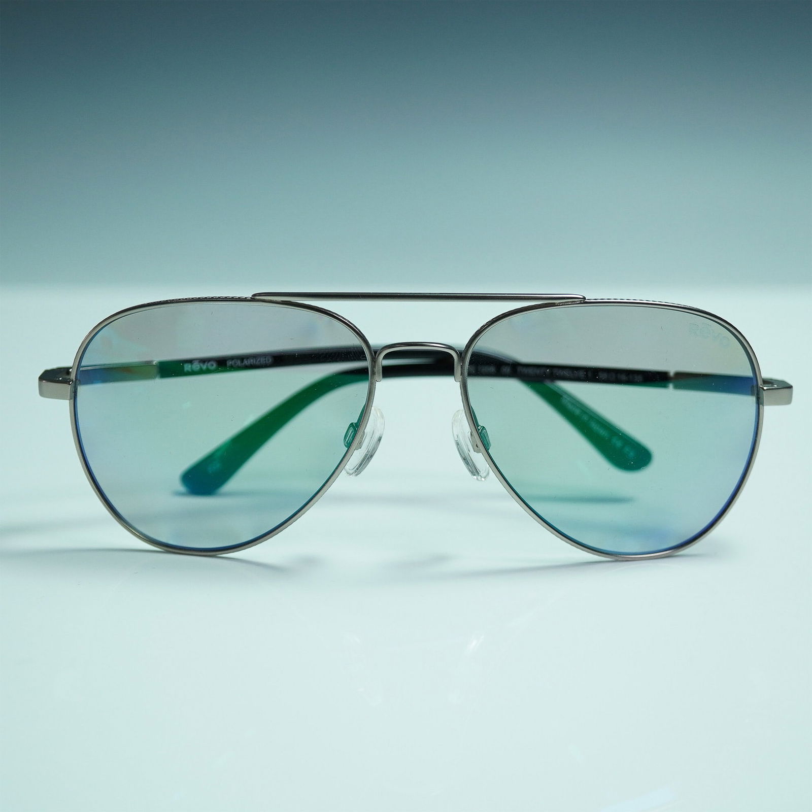 Revo Polarized Aviator Sunglasses, Twenty Twelve 1: Revo polarized aviator sunglasses, model Twenty Twelve 1 (RE 1206-00), made in Japan. These feature a sleek metal frame with a double bridge and classic teardrop-shaped lenses. The arms are finished i