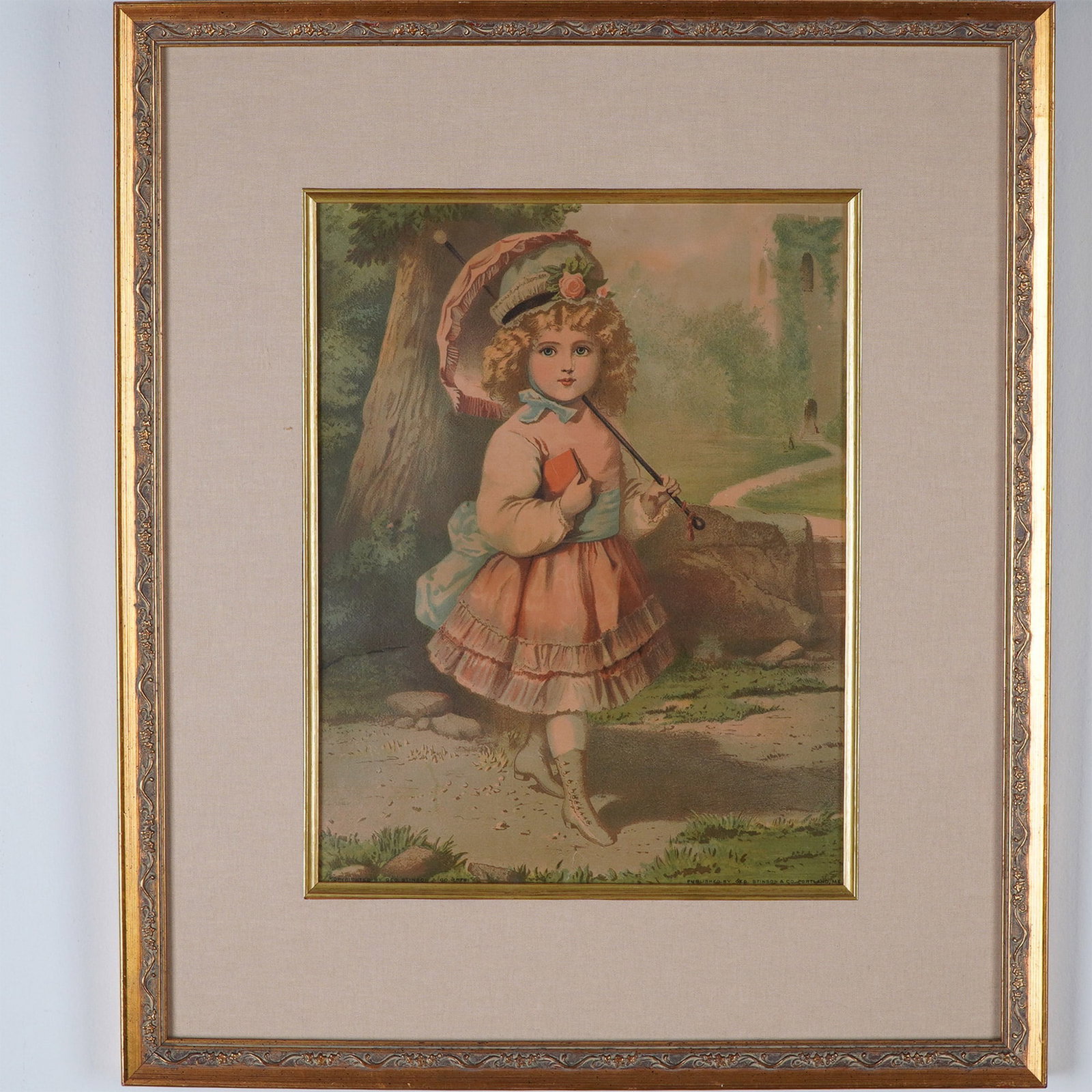 George Stinson & Co, Antique Chromolithograph of a Young Girl: A charming 19th-century chromolithograph depicting a young girl in Victorian attire, holding a parasol and a small book while strolling through a picturesque landscape. Her delicate features, intricat