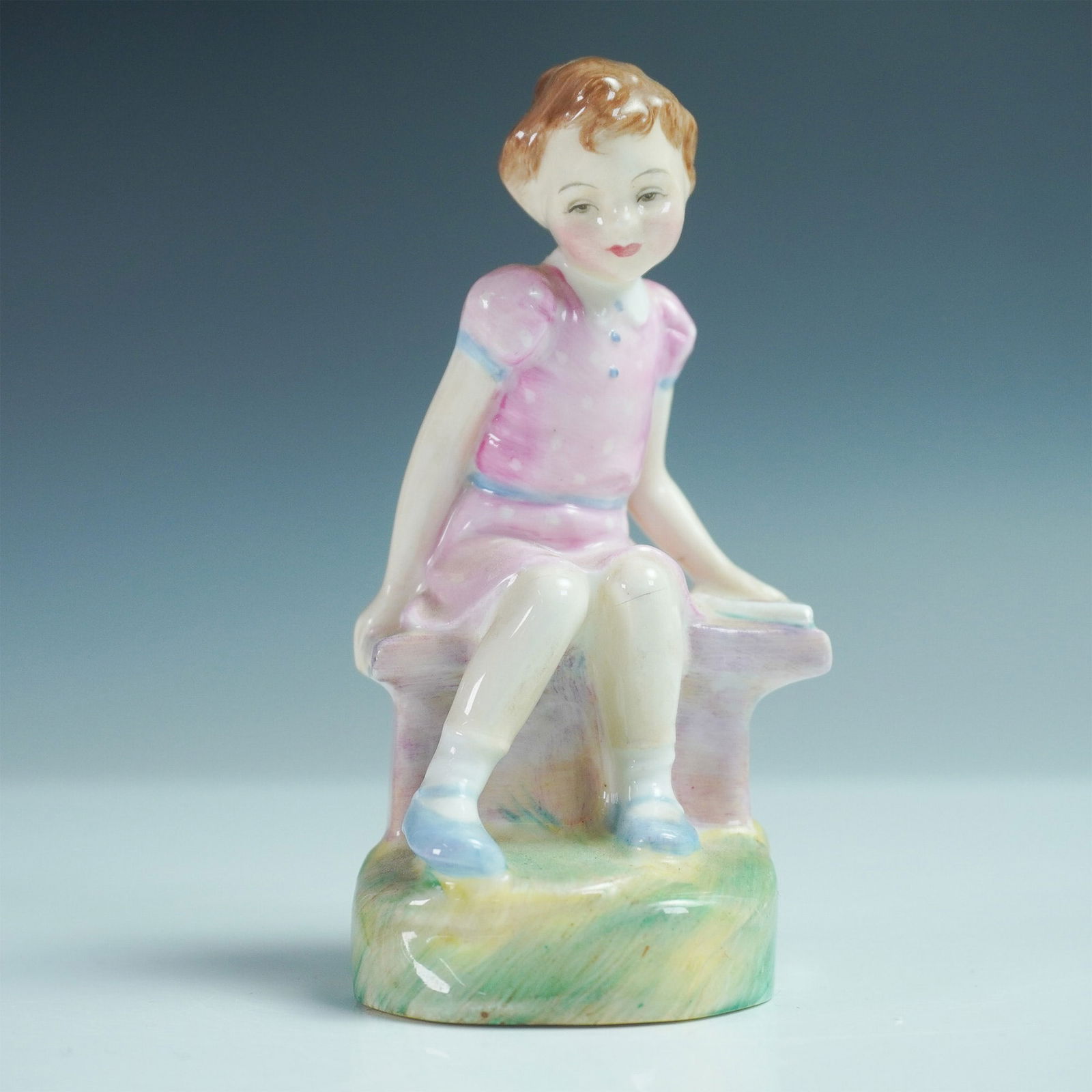 Royal Doulton Figurine 'Once Upon A Time' HN2047: Presenting the Royal Doulton 'Once Upon A Time' figurine, model number HN2047, designed by esteemed artist Leslie Harradine. Issued between 1949 and 1955, this 4.25-inch tall piece is part of the 'Nur