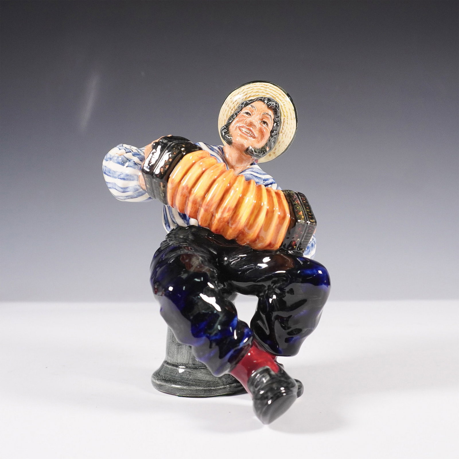 Royal Doulton Figurine, Jolly Sailor HN2172: A delightful addition to any Royal Doulton collection, Jolly Sailor HN2172 was designed by Mary Nicoll and issued between 1956 and 1965. This fine bone china figurine captures the lighthearted spirit 