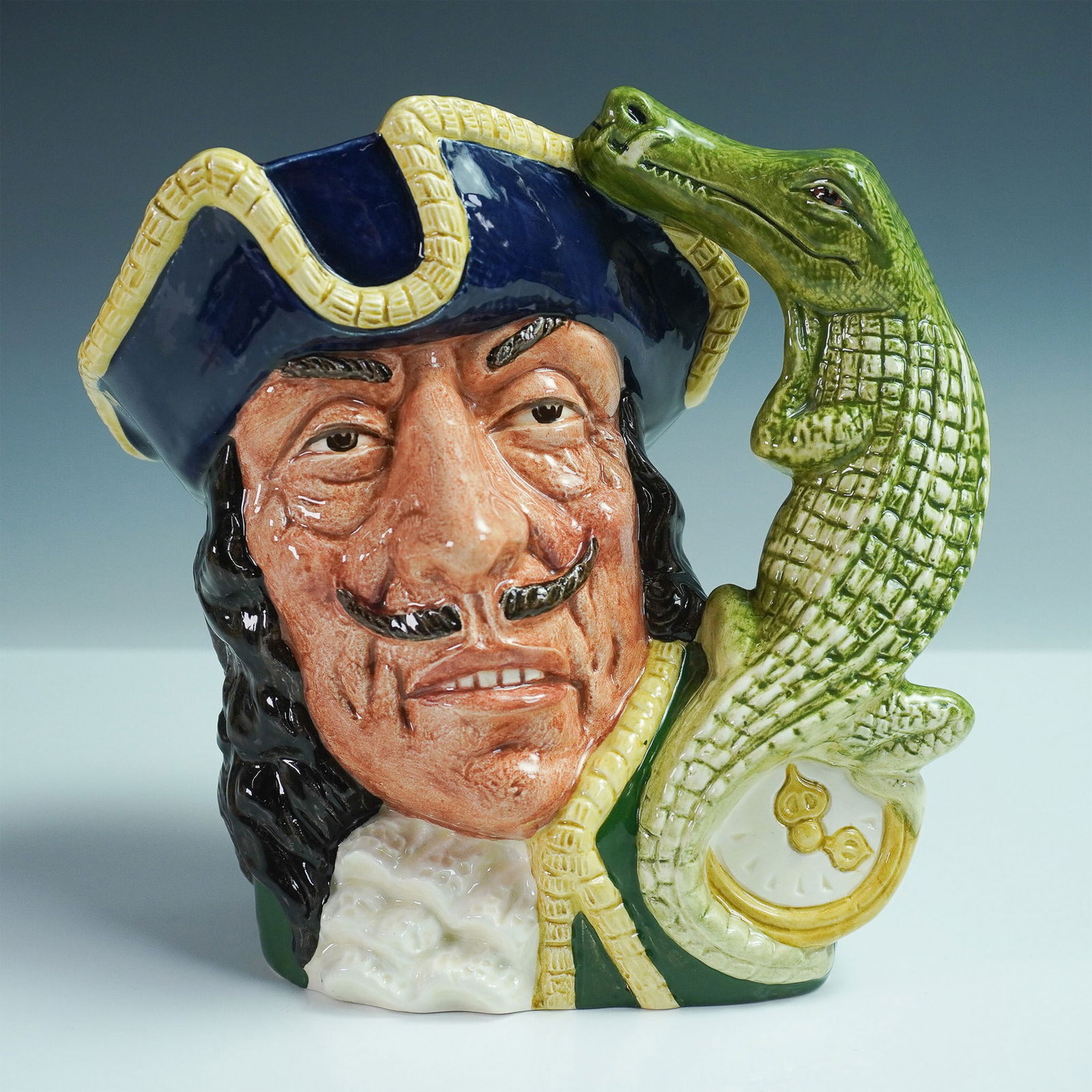 Royal Doulton Large Character Jug Captain Hook D6597: Royal Doulton large character jug of Captain Hook (D6597), issued in 1964 as part of the Characters from Literature series. Designed by David B. Biggs and Max Henk, this hand-painted ceramic jug depic