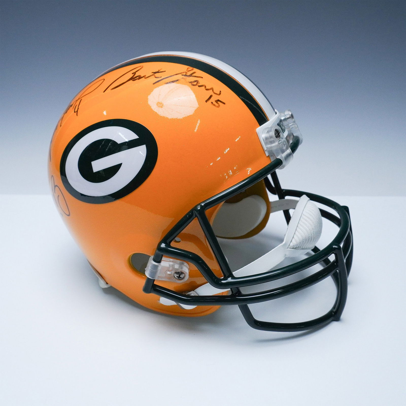 Green Bay Packers Helmet Signed by Bart Starr, Brett Favre & Aaron Rodgers (1 of 8)