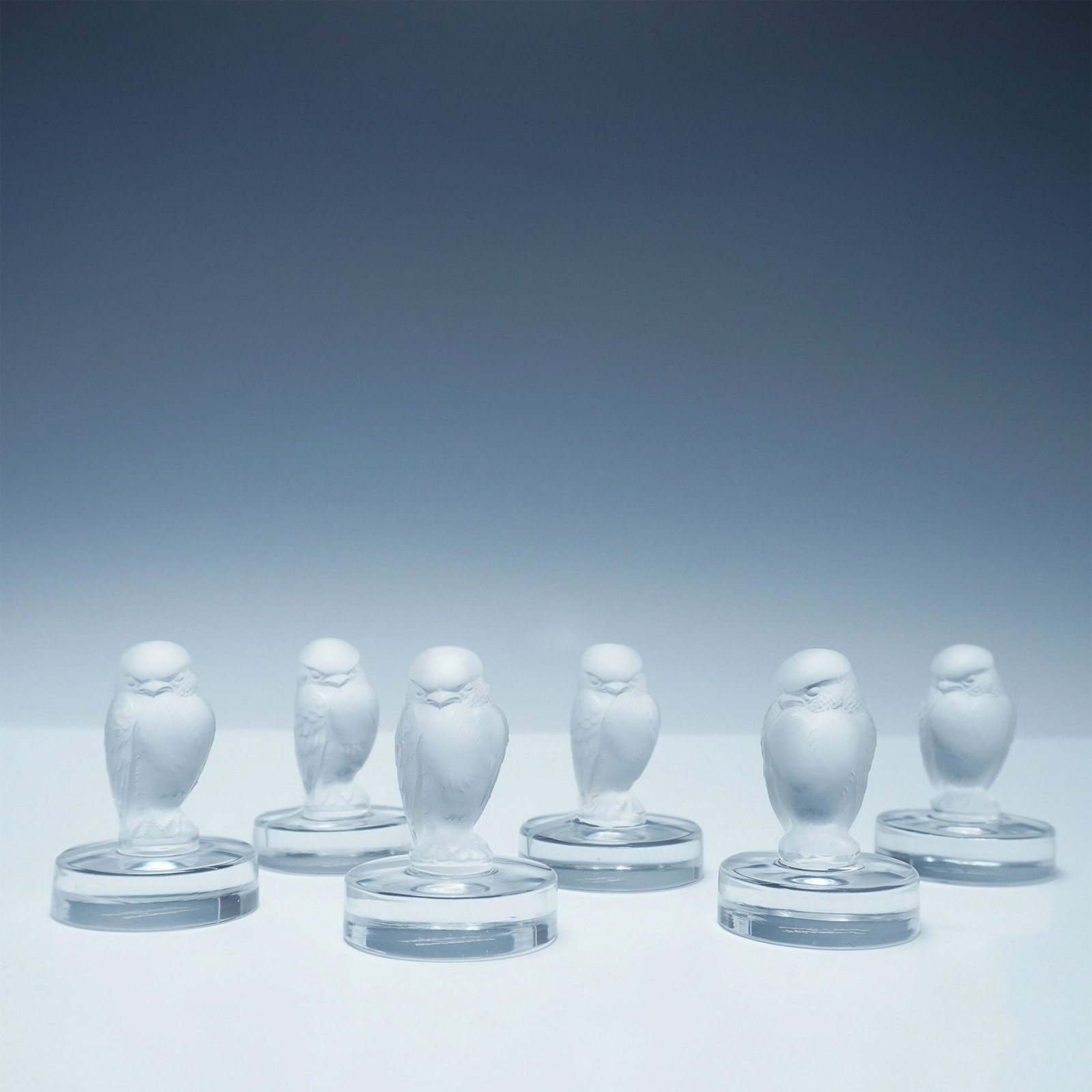 6pc Lalique France Frosted Crystal Owl Knife Rests: Elegant set of six Lalique France frosted crystal owl knife rests, embodying the exquisite craftsmanship of the renowned French glassmaker. Each piece features a finely detailed frosted owl perched at