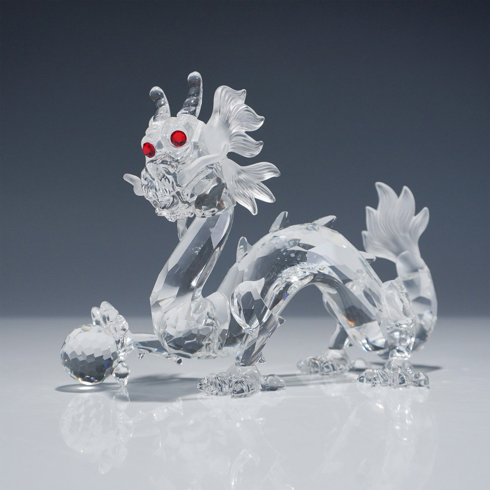 Swarovski Crystal Figurine, Dragon 208398: Swarovski crystal figurine depicting a dragon, released in 1997 as part of the "Fabulous Creatures" trilogy. This was the second piece in the trilogy and was available exclusively to Swarovski Crystal