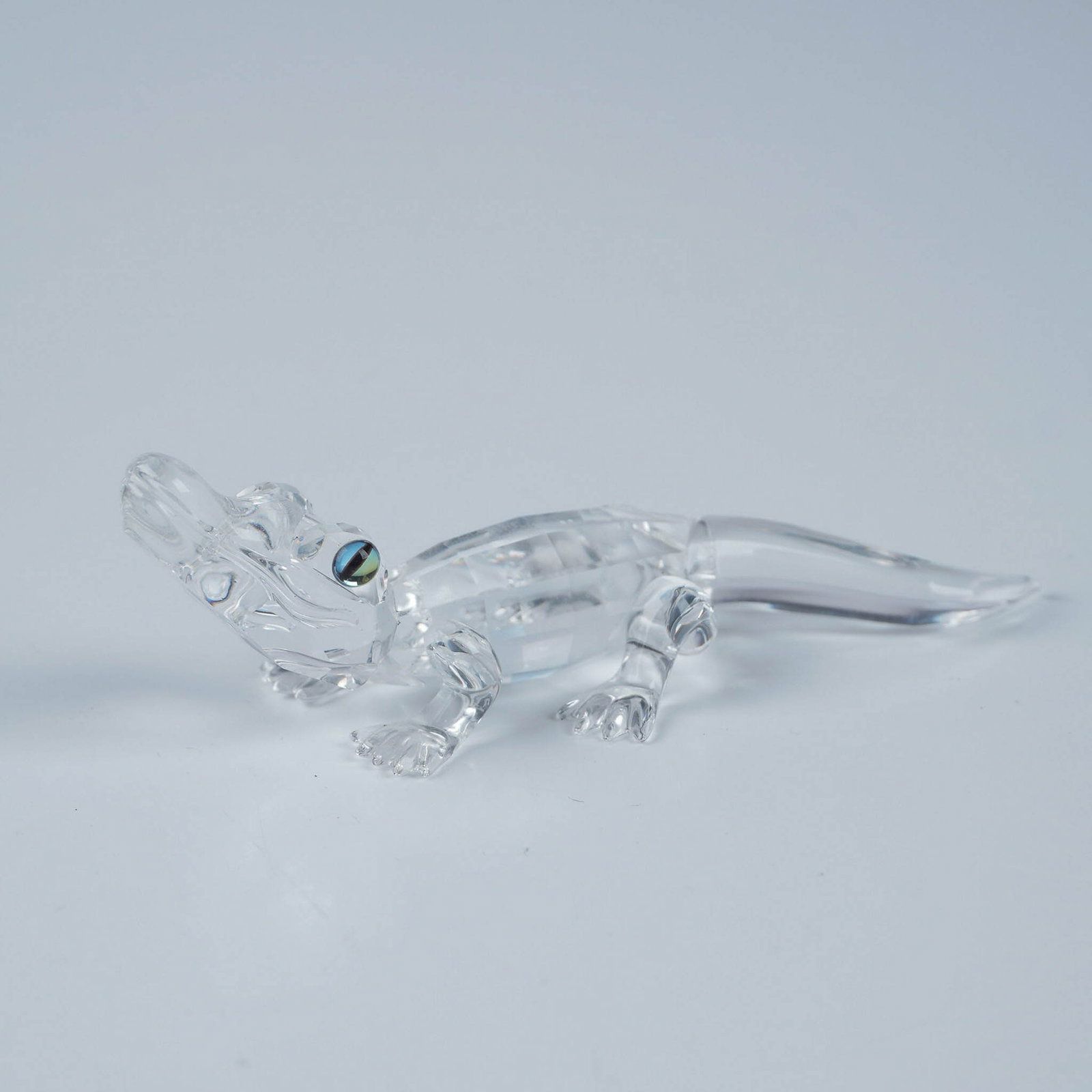 Swarovski Crystal Figurine, Alligator with Original Box: Retired Swarovski crystal Alligator figurine, originally part of the Endangered Species family group. Crafted from clear faceted and molded crystal, this detailed piece showcases Swarovski's signature