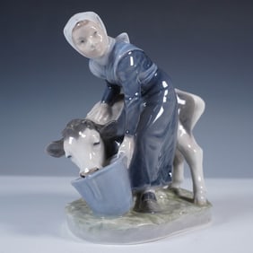 Royal Copenhagen Porcelain Figurine, Girl with Calf #779