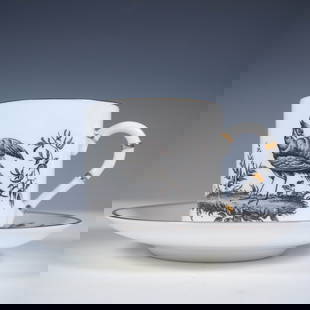 Royal Worcester Demitasse Cup and Saucer Set: Royal Worcester fine bone china demitasse cup and saucer set featuring intricate black botanical and bird illustrations. The petite cylindrical cup depicts a finely detailed game bird in a naturalisti