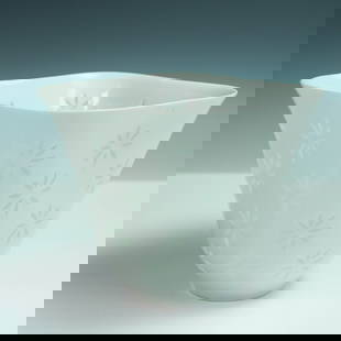 Arabia Finland Rice Porcelain Bowl by Friedl Holzer-Kjellberg: Designed by Friedl Holzer-Kjellberg for Arabia Finland, this translucent white porcelain bowl is a striking example of the rice porcelain technique, where small floral cutouts are filled with glaze to