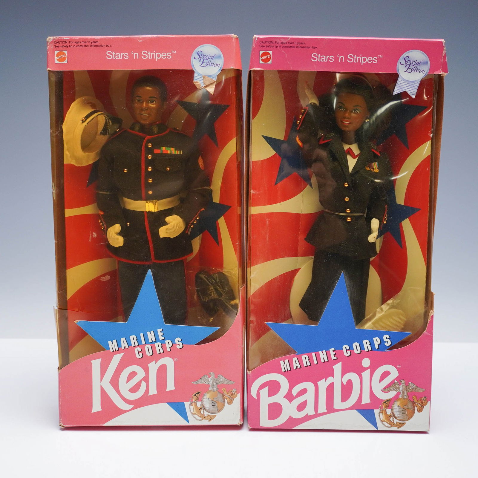 2pc Mattel Marine Corps African American Barbie & Ken Dolls: Pair of Mattel special edition dolls from the Stars 'n Stripes collection, each in their original box. This 2-piece set includes Marine Corps Barbie (7594) and Marine Corps Ken (5352), both depicted i