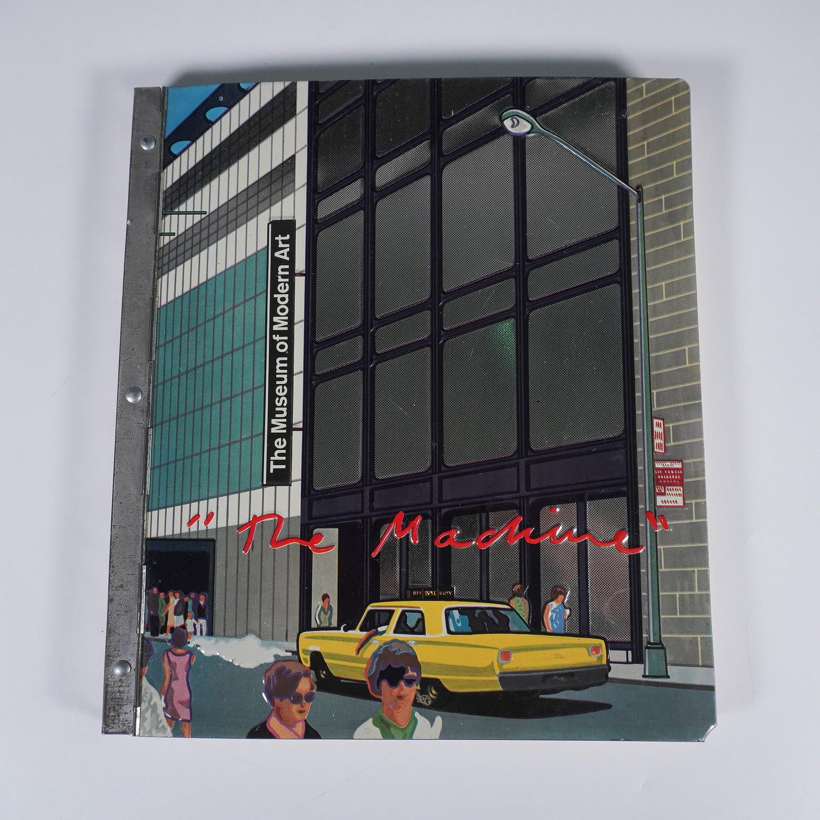 Metal Cover, The Machine Exhibition Book, MoMA 1968: Published in 1968 by The Museum of Modern Art, New York, The Machine: As Seen at the End of the Mechanical Age is a groundbreaking exhibition catalog curated by K.G. Pontus Hulten. Housed in a unique 