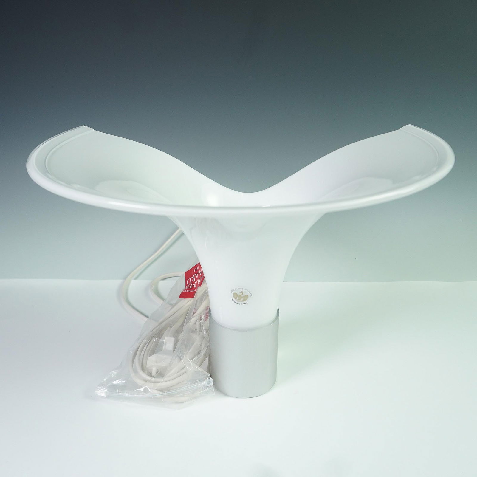 Michael Bang For Holmegaard Wall Lamp, Mandarin: Designed by renowned Danish glass artist Michael Bang for Holmegaard, this sculptural pendant light exemplifies mid-century Scandinavian design. Crafted from mouth-blown white opaline glass, the flare