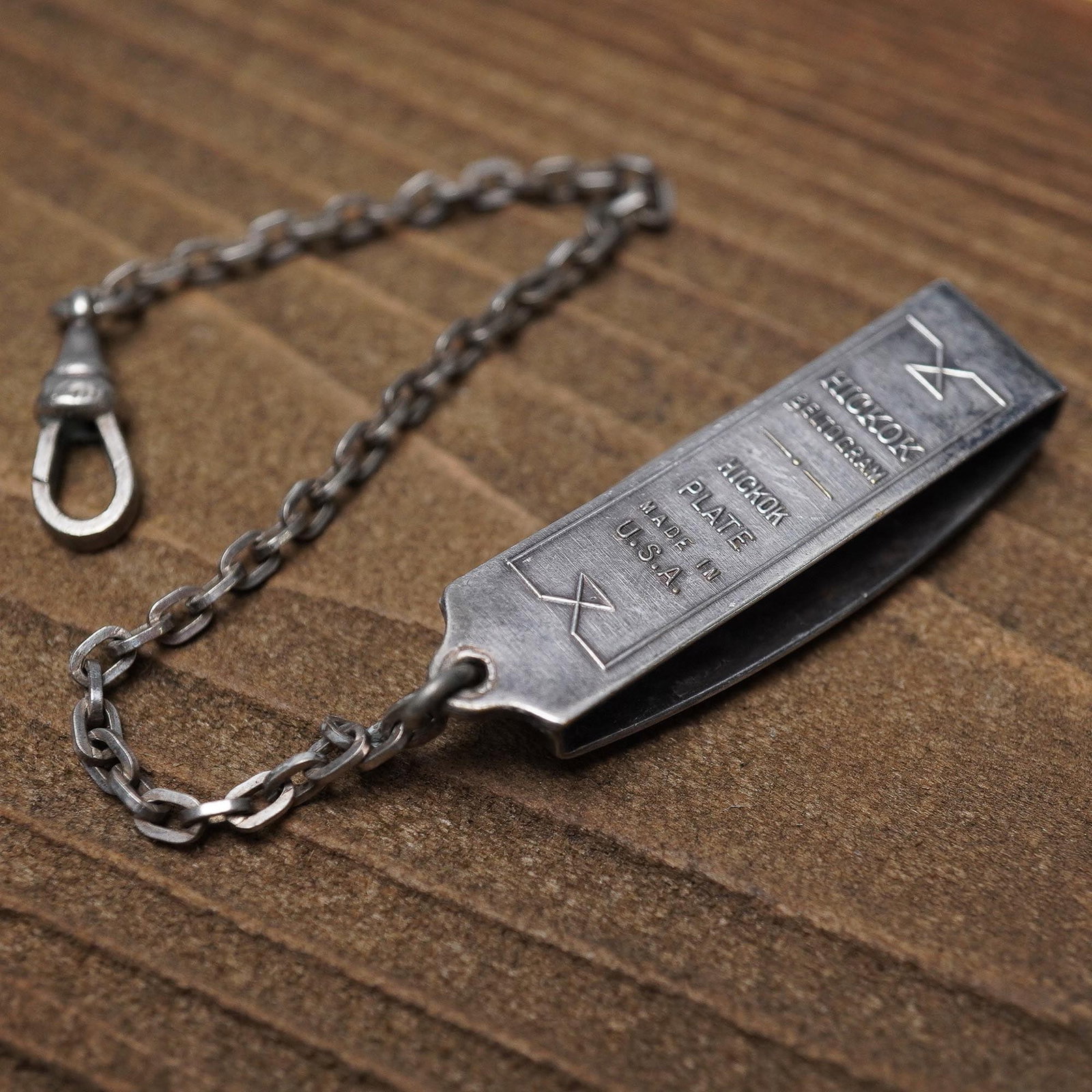 Hickok Beltogram Silverplate Watchchain: Vintage Hickok Beltogram watchchain with original silverplate finish, featuring Art Deco-style engraving and geometric detailing on the front. The reverse is marked "HICKOK BELTOGRAM," "TRADEMARK," "P