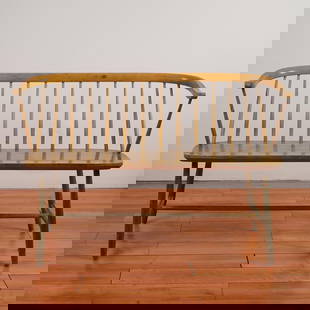 Nesto Stolfabrik Swedish Mid-Century Wooden Bench: A charming mid-century modern wooden settee, designed in the classic Windsor style. The piece features a gracefully curved top rail with a row of slender vertical spindles forming the backrest and gen
