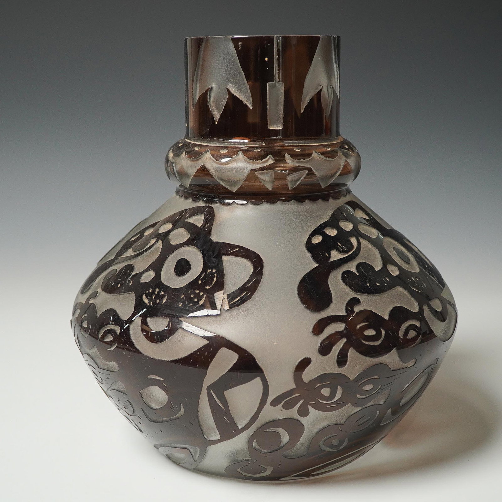 Richard Weisl for Kaiser Glass Art Vase Signed: Elegant hand-blown art glass vase designed by Richard Weisl for Kaiser, featuring a smoky brown tone with a smooth, glossy surface cut to reveal frosted glass beneath. The vase is adorned with intrica