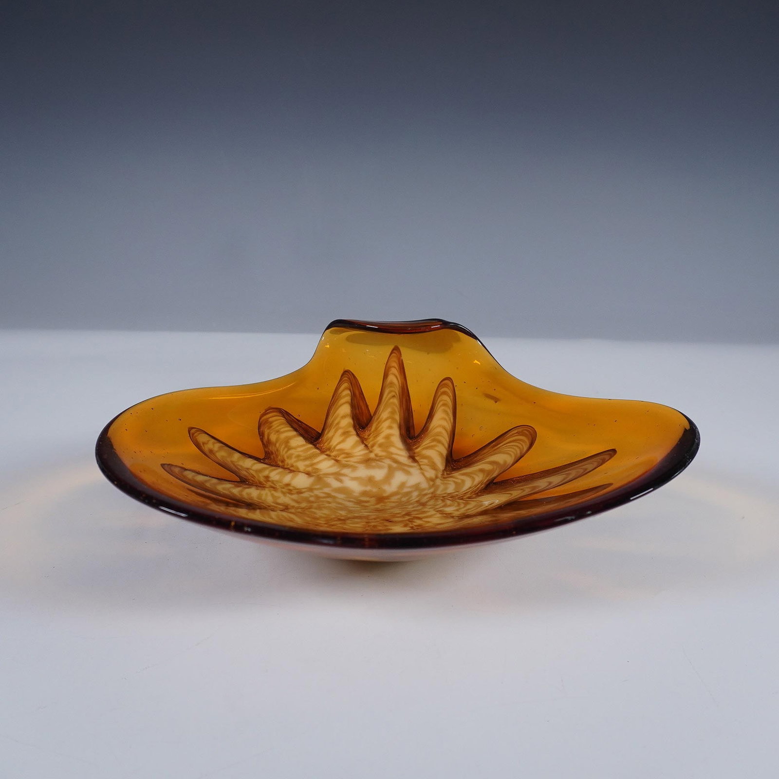 Amber & Gold Aventurine Art Glass Dish: Lovely vintage mid-century modern art glass bowl featuring amber and copper aventurine colors. The bowl has a distinct floral-like center with folded handkerchief edge. Issued: 20th century Dimensions