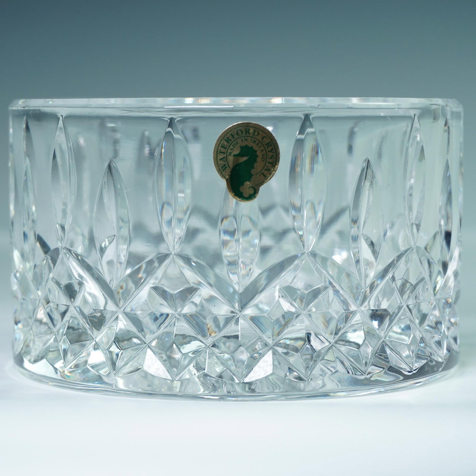 Waterford Crystal Lismore Wine-Champagne Coaster: Cut crystal wine coaster in the iconic Lismore pattern by Waterford. This piece features the classic combination of crisscross and vertical cuts that define the Lismore design, Waterford's most enduri