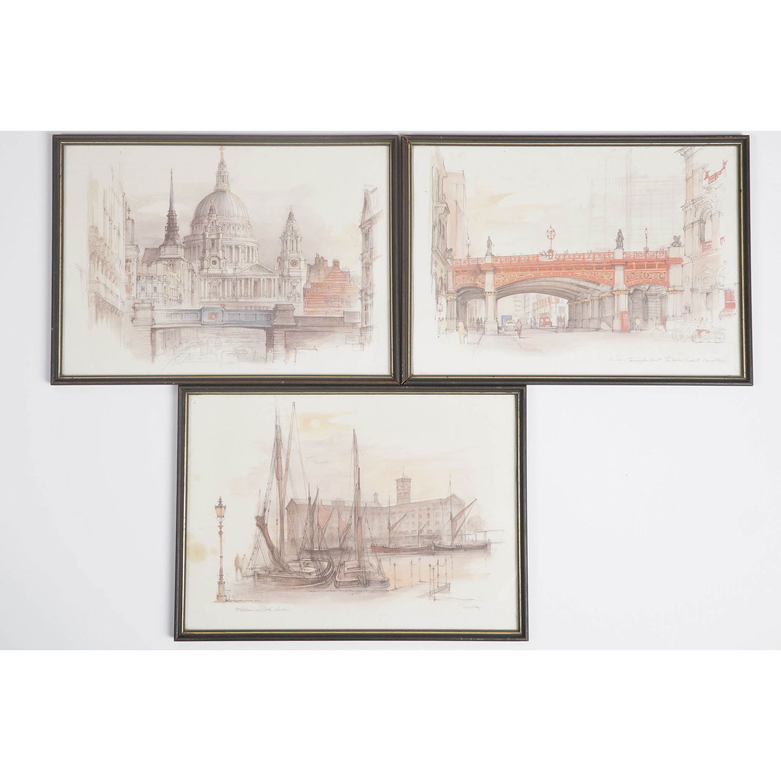 3pc Mads Stage (Danish) Framed London Architectural Prints: Set of three framed prints by Danish artist Mads Stage, each depicting a distinct architectural scene in London with delicate detail and muted watercolor tones. The views include: St. Katharine Docks