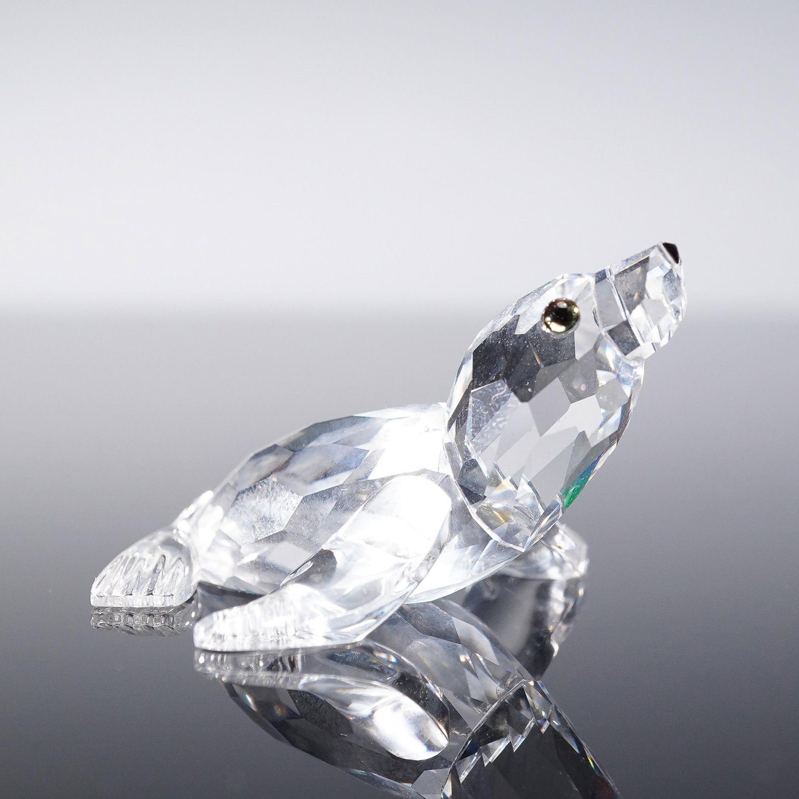 Swarovski Crystal Figurine, Baby Sea Lion: This Swarovski Crystal Baby Sea Lion figurine captures the playful nature of the marine animal in a dazzling faceted crystal design. The figurine features a clear crystal body with finely cut details 
