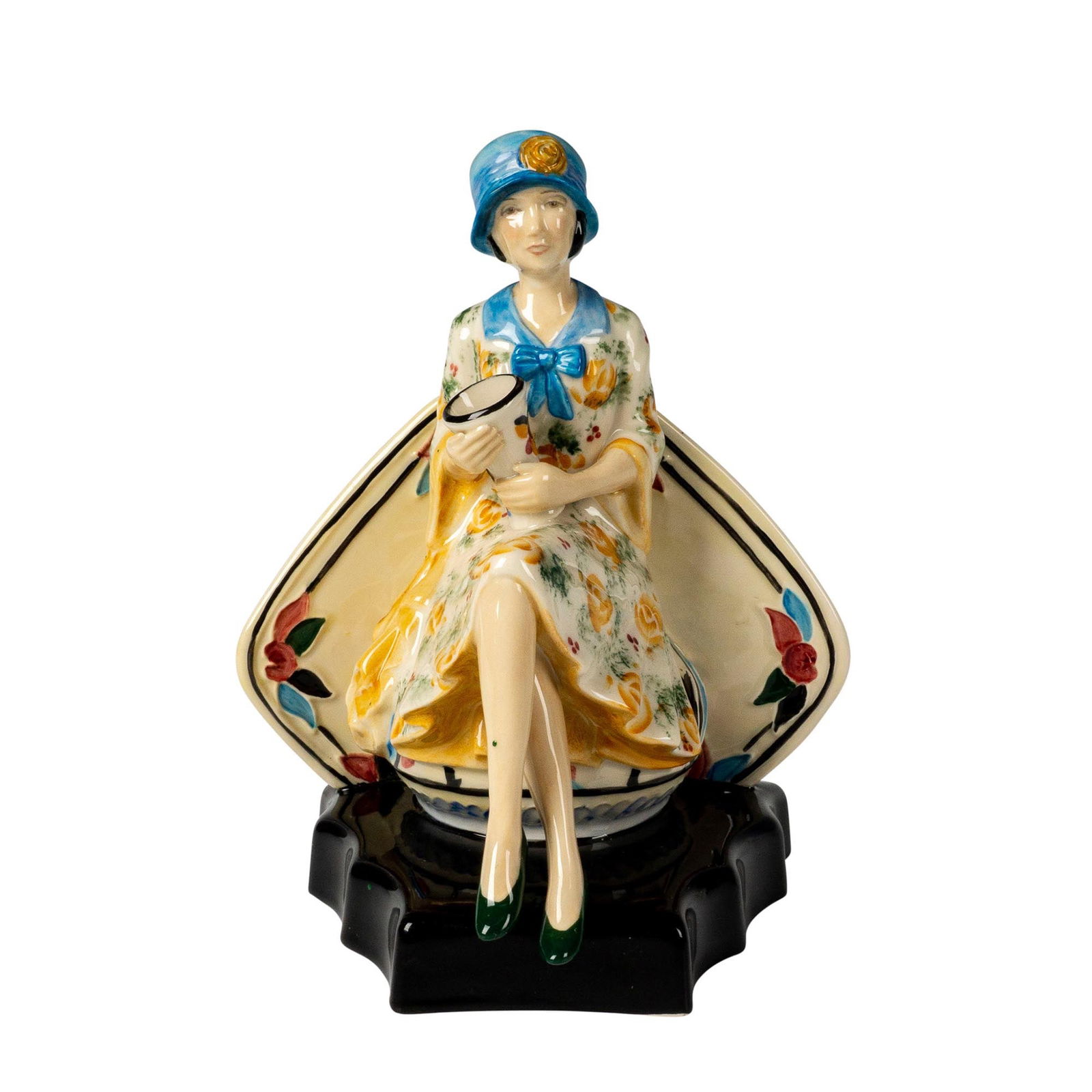 Peggy Davies Colorway Figurine, Charlotte Rhead: Colorway art deco style, featuring the ceramist seated with vase in hand. Peggy Davies backstamp. Dimensions: 7"L x 5"W x 8.5"H Country of Origin: England