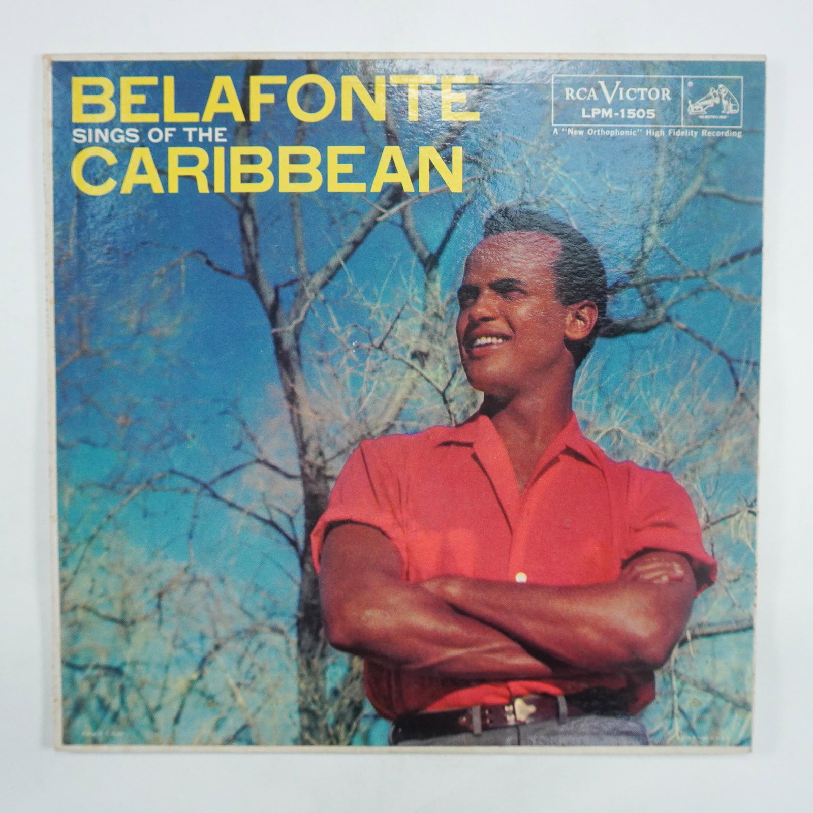 Harry Belafonte, Belafonte Sings of the Caribbean Vinyl Record: RCA Victor LPM-1505 first press of Belafonte Sings of the Caribbean, featuring Harry Belafonte. This 33 1/3 RPM vinyl record presents a collection of Caribbean-inspired songs performed by the legendar