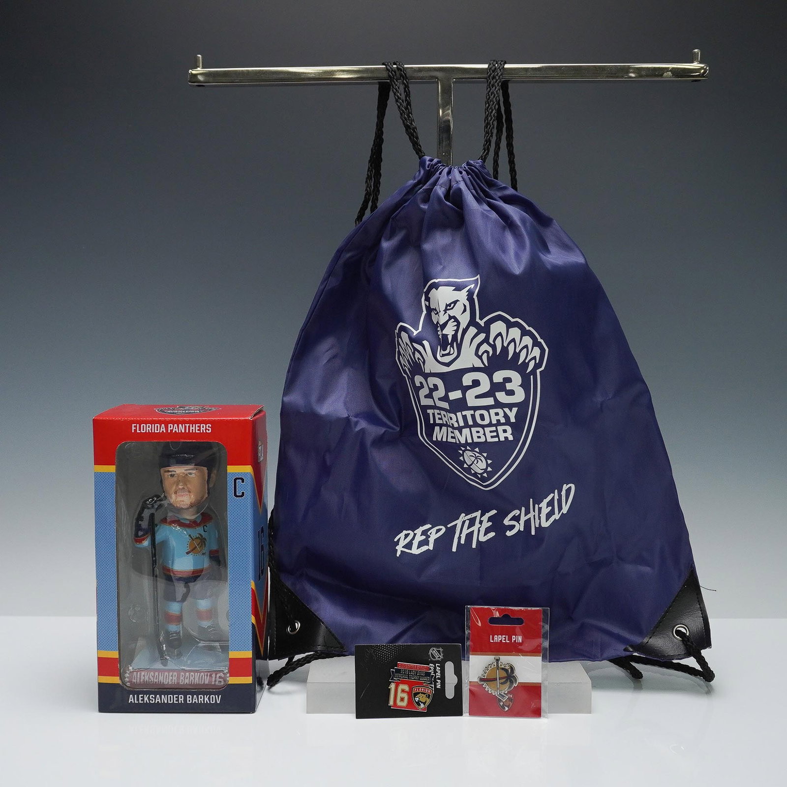 4pc Florida Panthers Fan Pack, Barkov Bobblehead, Pins, and Bag: A 4-piece Florida Panthers memorabilia set featuring official NHL fan items. Includes: 1) Aleksander Barkov bobblehead in original box, 2) 2019 Lady Byng Memorial Trophy Winner lapel pin featuring Bar