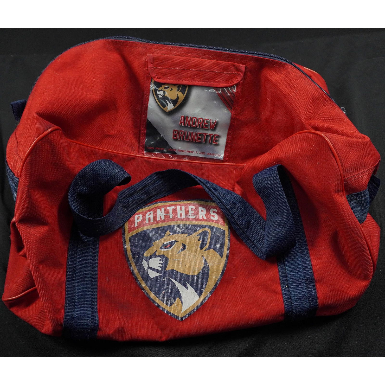 2pc Florida Panthers NHL Equipment Bags, Andrew Brunette & Aaron Ekblad: Two-piece Florida Panthers NHL player-issued gear bags. The first is a red duffel bag featuring the Panthers logo and player identification window labeled Andrew Brunette, suggesting team-issued use.