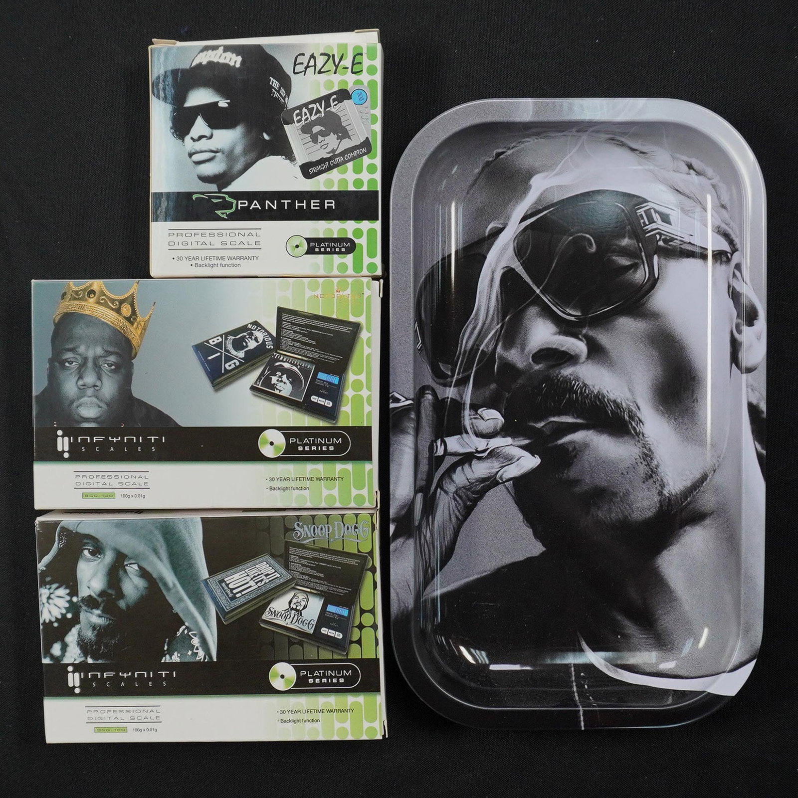 4pc Hip Hop Legend Digital Scales & Rolling Tray Set: 4 piece set featuring professional digital pocket scales and a matching rolling tray inspired by hip hop legends. Includes a Panther digital scale with Eazy-E artwork and Straight Outta Compton graphi