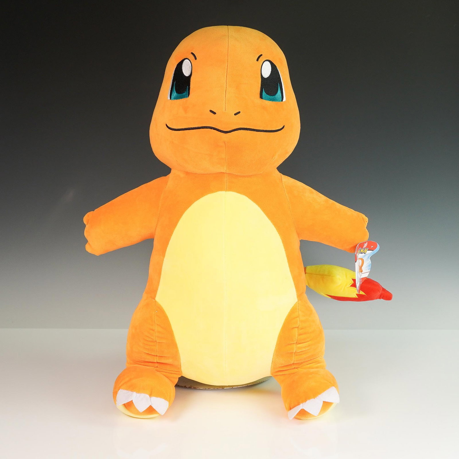 Pokemon Charmander Plush Toy: Official licensed Pokemon plush toy featuring the character Charmander, known from the popular Pokemon series by Nintendo, Game Freak, and Creatures. This large-scale plush measures 24 inches in heigh