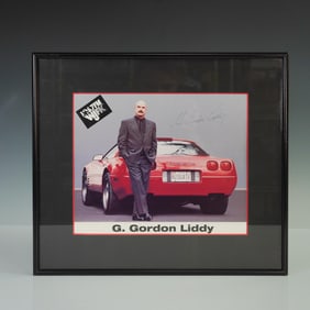Framed G. Gordon Liddy Autographed Photo with Corvette