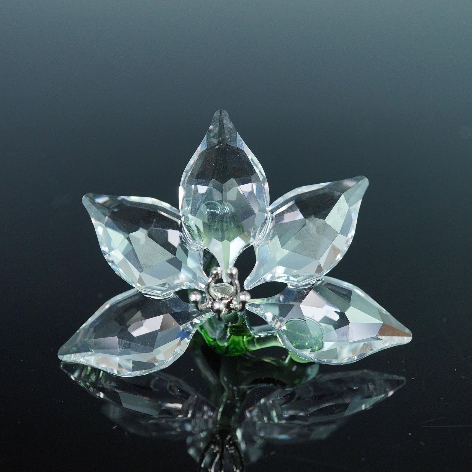 Swarovski Crystal Figurine, Orchid 2013 SCS Gift: This Swarovski Orchid figurine was presented as the exclusive SCS Joining or Renewal Gift in 2013. Elegantly crafted with clear faceted crystal petals and a vibrant green crystal base, this delicate o