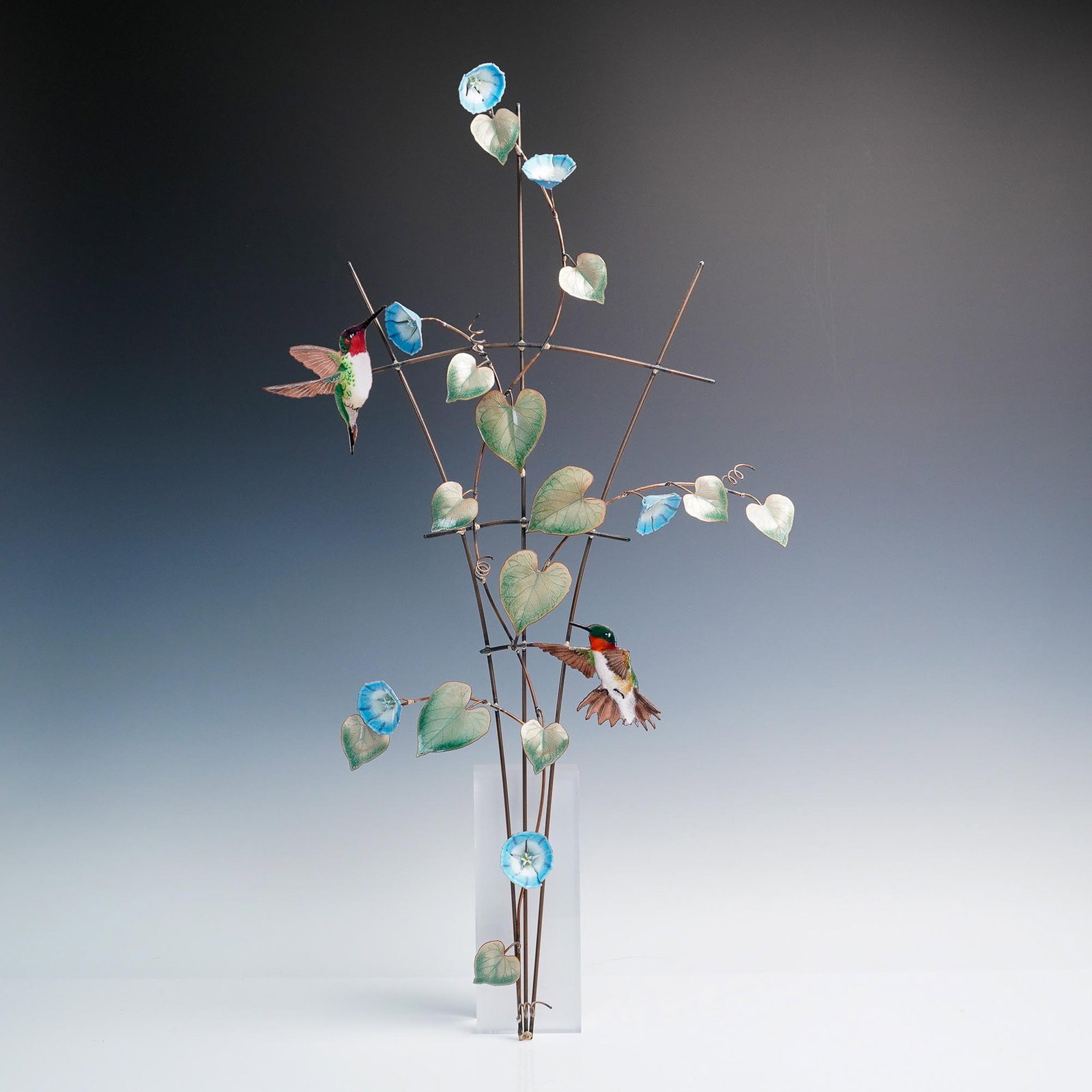 Bovano of Cheshire Enamel Morning Glory and Hummingbird Wall Sculpture: Graceful and airy wall sculpture by Bovano of Cheshire, USA, featuring vibrant morning glory vines in blue enamel with delicate heart-shaped leaves, all handcrafted in kiln-fired enamel on copper wire
