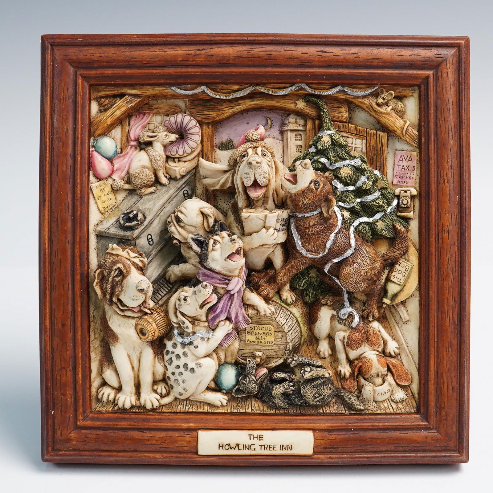 Harmony Kingdom Picturesque, The Howling Tree Inn: A limited edition picturesque plaque intricately sculpted in bas relief featuring a humorous and detailed scene of dogs gathered in a whimsical pub setting, surrounded by holiday decorations and festi