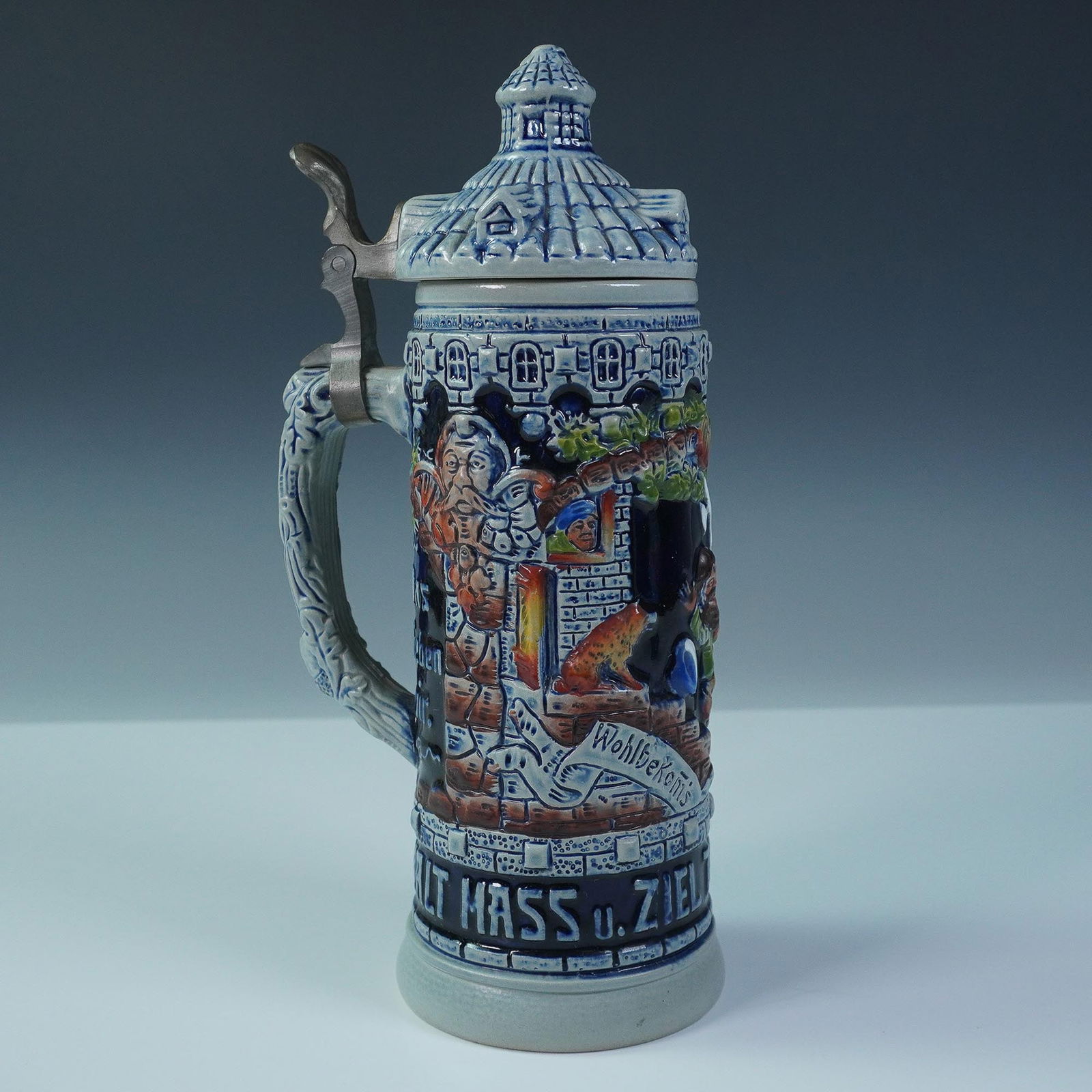 German Relief Beer Stein with Castle Tower Lid and Pewter Thumb Lift (1 of 5)