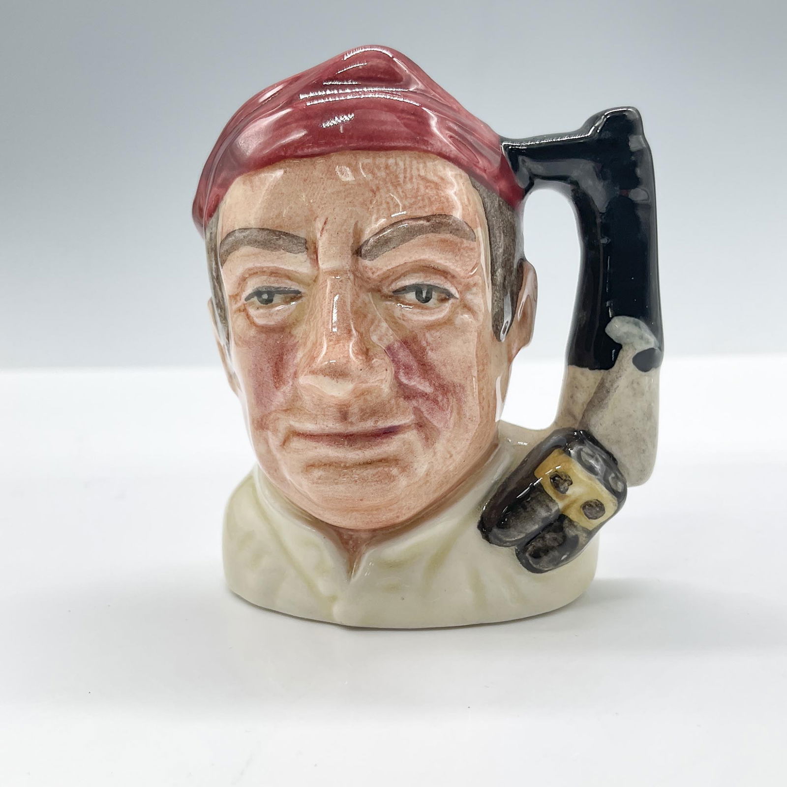 Bootmaker D6586 - Mini - Royal Doulton Character Jug: Royal Doulton backstamp. Artist: David B. Biggs Issued: 1963 - 1983 Dimensions: 2.5"H Country of Origin: England