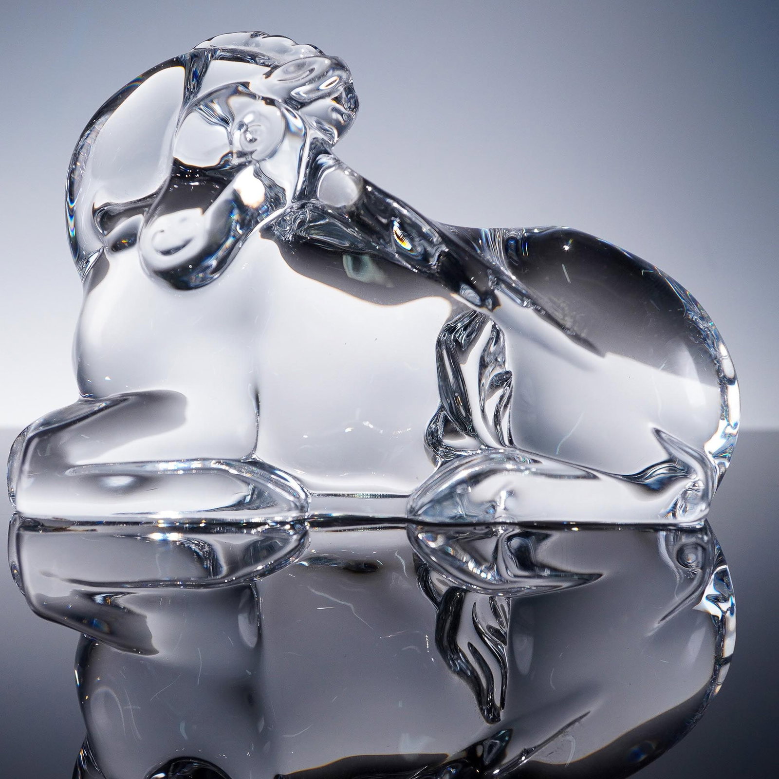 Baccarat Crystal Figurine, Unicorn: Baccarat clear crystal figurine of a unicorn, featuring a graceful pose, and prominent horn. Sculpted with soft, stylized lines, this enchanting piece embodies the mythical creature's serenity and sym